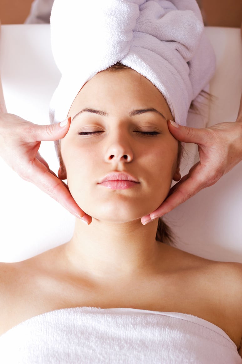 Young beautiful woman having facial treatment